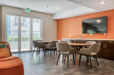 a conference room with a table and chairs and a tv at North Hollywood 2BR w Gym Pool nr TJ LAX-880 in Los Angeles