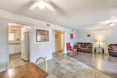 a living room with a table and a couch at 1 Mi to SoFi! Convenient Inglewood Condo in Inglewood