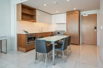 a kitchen with a table and chairs in it at Level Downtown LA South Olive in Los Angeles