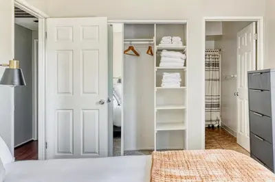 a bedroom with a closet with white doors and towels at N Hollywood 2BR w Gym Pool nr TJ Shops LAX-591 in Los Angeles