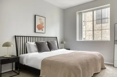 a white bedroom with a large bed and a window at Beverly Hills 2BR near the Grove Rodeo Drive LAX-866 in Los Angeles