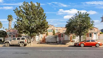 a truck and a car parked in front of houses at Rock n Roll by AvantStay in Los Angeles