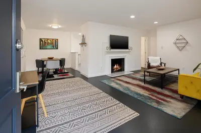 a living room with a fireplace and a tv at Quaint 1BD 1BA Bungalow in Los Angeles