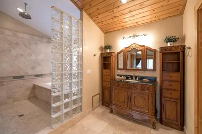 a bathroom with a shower and a sink and a tub at Big Bear Village View Haus is a large pet and kid friendly chalet with hot tub located a short walk to village in Big Bear Lake
