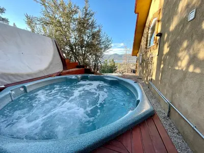a hot tub on the side of a building at Big Bear Village View Haus is a large pet and kid friendly chalet with hot tub located a short walk to village in Big Bear Lake