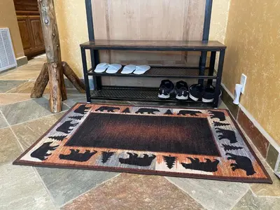 a room with a rug and a shelf with shoes at Big Bear Village View Haus is a large pet and kid friendly chalet with hot tub located a short walk to village in Big Bear Lake
