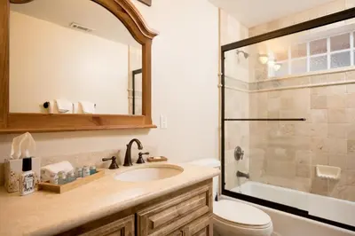 a bathroom with a sink and a shower at Big Bear Village View Haus is a large pet and kid friendly chalet with hot tub located a short walk to village in Big Bear Lake