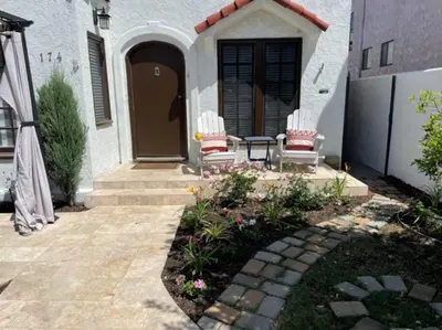 a house with two chairs and a patio at The Heart of Belmont Shore in Long Beach