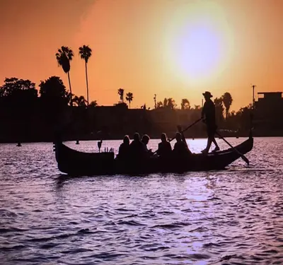 a group of people on a boat in the water at The Heart of Belmont Shore in Long Beach