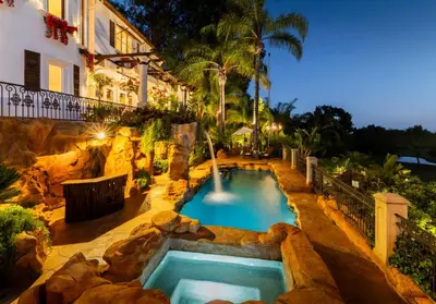 a swimming pool in a backyard with a resort at Bel Air Luxury Villa 6 bedrooms entire house Los Angeles in Los Angeles