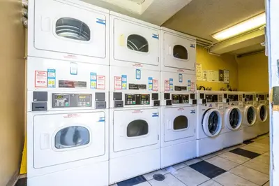 a bunch of washing machines in a laundry room at Sherman Oaks 1BR w Pool Gym BBQ nr TJ WF LAX-487 in Los Angeles