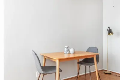 a dining room table with three chairs and a lamp at Sherman Oaks 1BR w Pool Gym BBQ nr TJ WF LAX-487 in Los Angeles