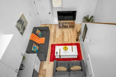 an overhead view of a living room with a couch and a table at Cozy Oasis near Griffith Observatory in Los Angeles
