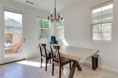 a dining room with a wooden table and chairs at Family-Friendly Camarillo Home with Access to Pools! in Camarillo