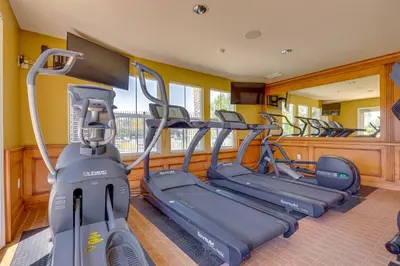 a gym with several tread machines in a room at Family-Friendly Camarillo Home with Access to Pools! in Camarillo