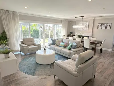 a living room with a couch and chairs and a table at Disneyland Paradise 6 BedRoom 4 Bathroom Pool Spa Games in Anaheim