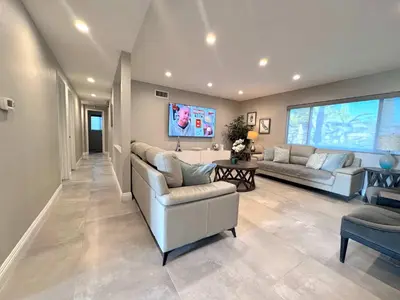 a large living room with couches and a tv at Cypress Villa Disneyland 8 Bedroom 4Bath Pool Game in Anaheim