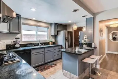 a kitchen with stainless steel appliances and a counter top at Cypress Villa Disneyland 8 Bedroom 4Bath Pool Game in Anaheim