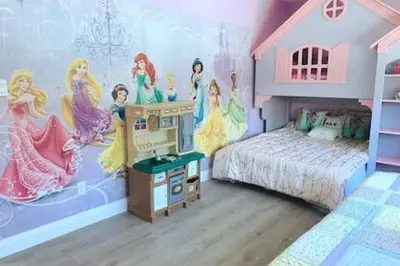 a bedroom with a disney princess mural on the wall at Cypress Villa Disneyland 8 Bedroom 4Bath Pool Game in Anaheim