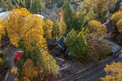 an aerial view of a house with trees at Hot Tub-EV-Kid Friendly-Arcade Game-BBQ-Fire Pit in Lake Arrowhead