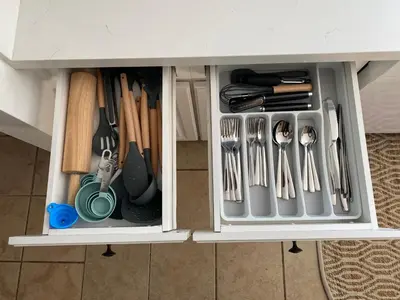 a drawer filled with utensils in a cabinet at Hot Tub-EV-Kid Friendly-Arcade Game-BBQ-Fire Pit in Lake Arrowhead