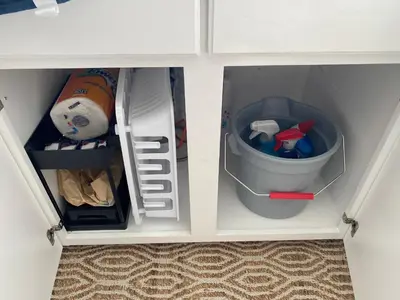 a white cabinet with a trash can and a stuffed animal at Hot Tub-EV-Kid Friendly-Arcade Game-BBQ-Fire Pit in Lake Arrowhead