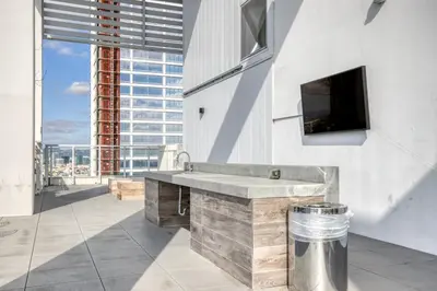 a bathroom with a sink and a large window at Downtown 1BR w Pool Jacuzzi Gym nr 110 LAX-836 in Los Angeles