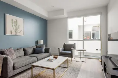 a living room with a couch and a table at Hollywood 1br w gym pool nr studios LAX-1036 in Los Angeles