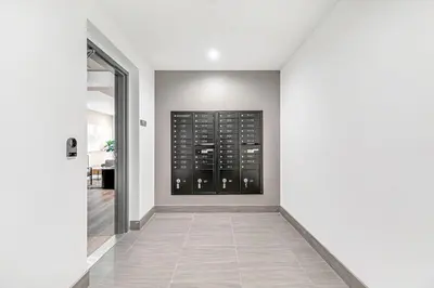a hallway with a white wall and a glass door at Hollywood 1br w gym pool nr studios LAX-1036 in Los Angeles