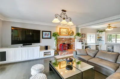 a living room with a couch and a tv at Stunning Home in Orange County with Stables! in Orange