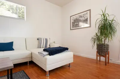 a living room with a white couch and a plant at 30 PCT OFF! Malibu Peaceful Getaway, Beach, Ocean in Malibu
