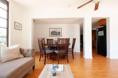 a living room with a table and chairs at 30 PCT OFF! Malibu Serene Cottage with King Bed, Beach, BBQ in Malibu